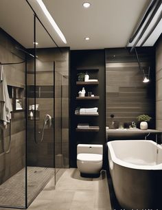 a bathroom with a bathtub, toilet and shower in it's center area