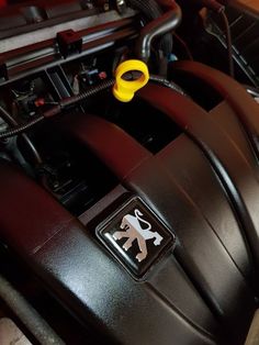 the engine compartment of a car with an emblem on it