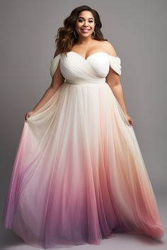 a woman in a white and pink ombreed dress with her hands on her hips