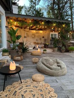 an outdoor patio with seating and lights