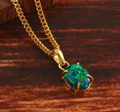 "💎 Gemstone:- Opal, Pendant  💎 Base Material:- 14K Gold Filled 💎 Stamps / Markings: JG (our brand name) 14K ( Gold Filled ) 💎 Stone Size 14x10 MM  100% SATISFACTION GUARANTEED GIFTING:- - We gladly ship packages directly to the gift recipient - If you mark an order as a Gift, receipts are not included OUR PROMISE:- - High Quality Material - Fine Craftsmanship - Superior Customer Service - Seamless Buying Experience Shipping policy:- Our delivery time is 11-21 days after shipping the goods de Fire Opal Jewelry, Black Opal Necklace, Pear-shaped Opal Necklaces For Gifts, Luxury Opal Pendant Necklace, Minimalist Jewelry Silver, Opal Multi-stone Pendant Necklace, Fire Opals Jewelry, Green Fire, Fire Opal Necklace