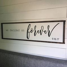 a wooden sign that says, we decided on forever and is hanging on the wall