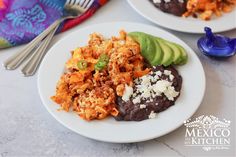 two white plates topped with different types of food