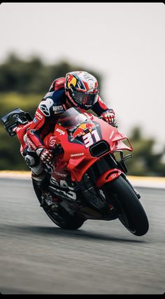 a person riding a motorcycle on a race track