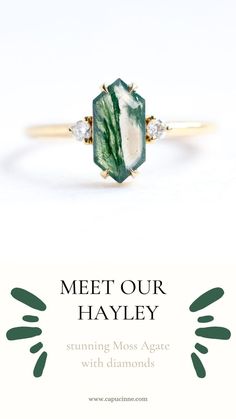 a green and white diamond ring with the words meet our hayley on it's side