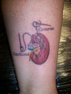 a person with a tattoo on their leg that says canon, garland and guitar strings