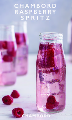 raspberry spritz in a mason jar with ice and fresh raspberries