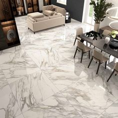 a living room filled with furniture and a marble floor