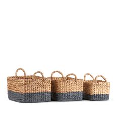 three woven baskets with handles on each side, one in grey and the other in beige