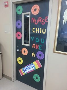 a classroom door decorated with donuts, candy and the words nurse chu you are