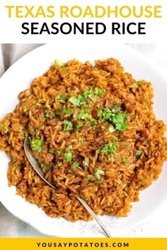 a white bowl filled with mexican rice and topped with cilantro