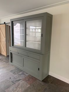 an empty room with several cabinets and doors