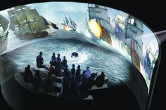 an animated image of people playing chess in front of a large screen with ships on it