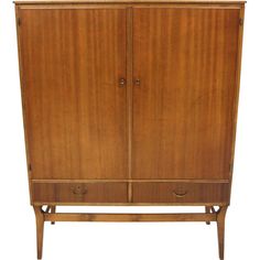 an old wooden armoire with two doors and three drawers on one side, against a white background