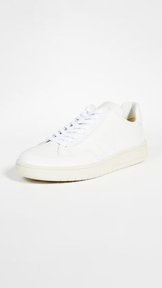 Leather: CowhideTonal logo at side and heelCushioned collarLace-up closureRound toeRubber soleImported, BrazilThis item cannot be gift-boxedStyle #VEJAA30418With a minimalistic, tonal silhouette, these Veja sneakers create a clean finish to any look. Veja Sneakers, New Arrivals, ? Logo, Sneakers, Free Shipping, Leather, Gifts