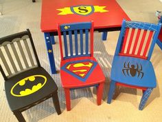 three children's wooden chairs with batman and spiderman logos on them