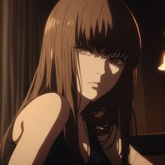 a woman with long hair and bangs looking at something in the distance while sitting down