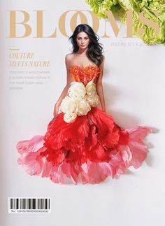 a woman in a red and pink dress on the cover of bloom's magazine