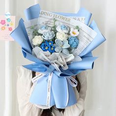 a woman is holding a bouquet of flowers