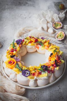 a cake with flowers on it sitting on a plate