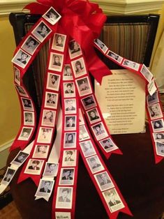 a red ribbon tied to a chair with pictures on it