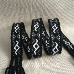 four black and white beaded wristbands