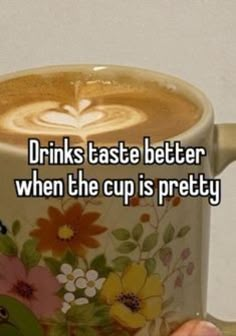 someone holding up a coffee mug with the words drinks taste better when the cup is pretty