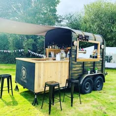 an outdoor bar is set up in the grass