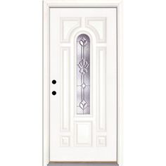 a white door with an ornate glass panel