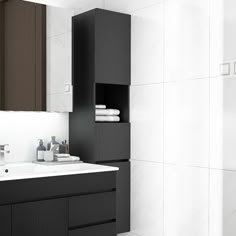 a bathroom with black cabinets and white tiles on the walls is pictured in this image