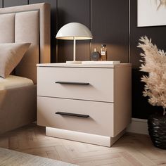 a nightstand with two drawers and a lamp next to it