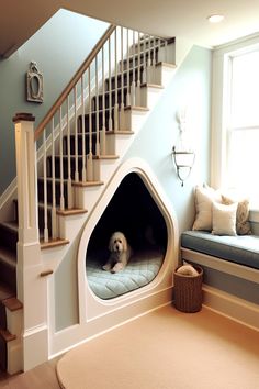 A fluffy white dog resting in a custom-built nook under a staircase, showcasing a popular Dog Room Under Stairs Idea. Dog Under Stairs, Under Stairs Ideas, Under Stairs Space, Under Stairs Storage Ideas, Stairs Storage Ideas, Under Stairs Nook