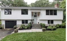 a white house with black doors and windows