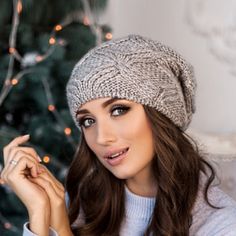 "Warm and cozy alpaca chunky knit gray slouchy beanie hat Trendy chunky knit warm slouchy hat - real decoration of the winter image of a woman. This stunningly beautiful with beautifully twisted around the edge volumetric beret is suitable for any age. This model adding flirty charm to the everyday image. Tam hat reliably warms his head from the cold. Chunky knit. Beret takes a good shape, does not sag. Season: Fall / Winter / Spring Cap length on average 11-11.1/2 \" Unlined Composition: mix al Sag Season, Tam Hat, Slouch Beanie Hats, Knitted Wool Beanie, Knit Beret, Slouchy Beanie Hat, Wool Hat Knit, Slouch Beanie, Cozy Hat