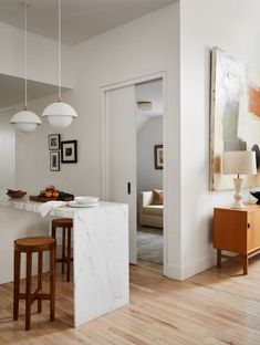 the kitchen is clean and ready to be used as a living room or dining area