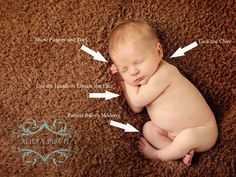 a baby is sleeping on the ground with arrows pointing to it's head and body