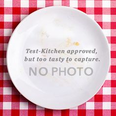 a white plate on a red and white checkered table cloth with the words tea - kitchen approved, but to try to capture, no photo