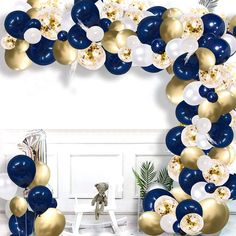 blue and gold balloon arch with white and gold balloons