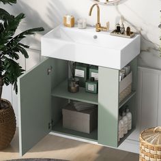 a white sink sitting under a bathroom mirror next to a green cabinet filled with items