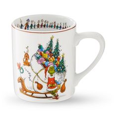 a white coffee mug with christmas decorations on the rim and handles, decorated with santa's sleigh