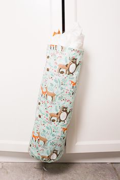 the diy plastic bag holder is made from an old diaper and has deers on it