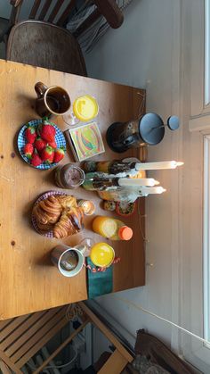 a wooden table topped with lots of food