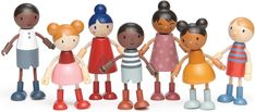 a group of wooden dolls standing next to each other