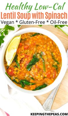 a bowl of lentil soup with spinach and vegetables