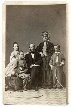 an old black and white photo of a family