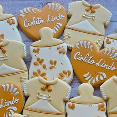 decorated cookies are arranged in the shape of teapots and heart - shaped biscuits