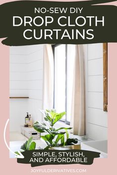 a white sink sitting under a window next to a green plant