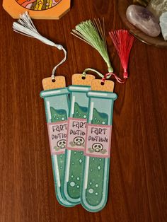 two toothbrushes are sitting on a table next to some other items and decorations