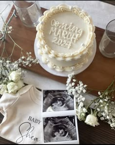 there is a cake and baby's first year photo next to it on the table