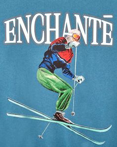 a man riding skis down the side of a snow covered slope with words enchante on it